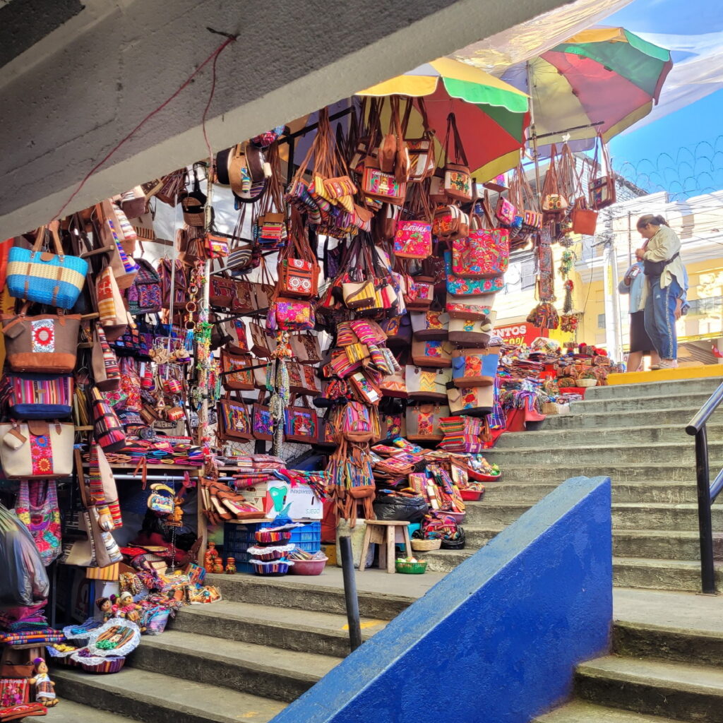 Colorful purses line the stairway at the mercado central in Guatemala City.